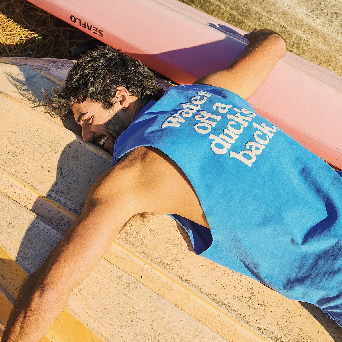 Ducks Back Slang Muscle Tank in Blue