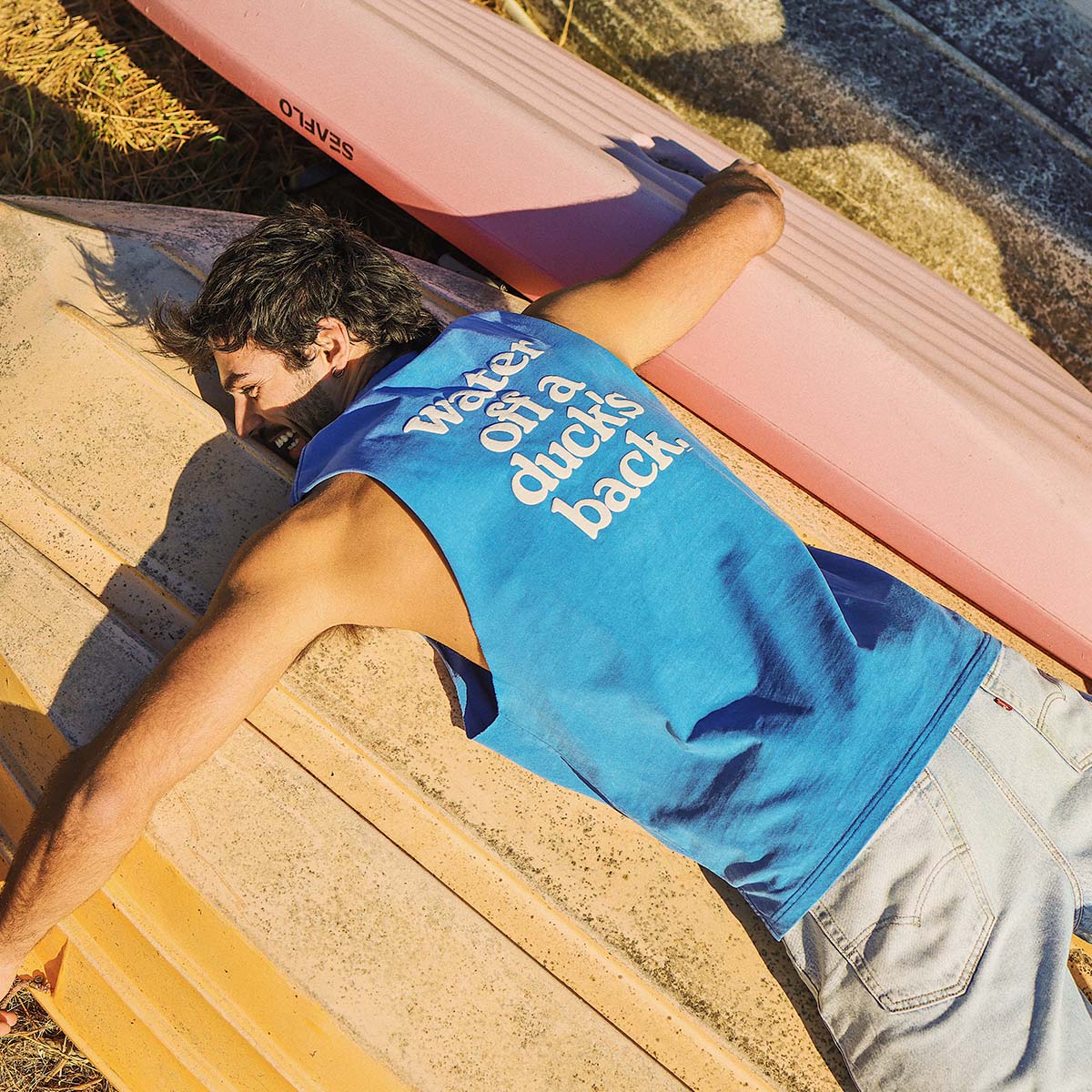 Ducks Back Slang Muscle Tank in Blue